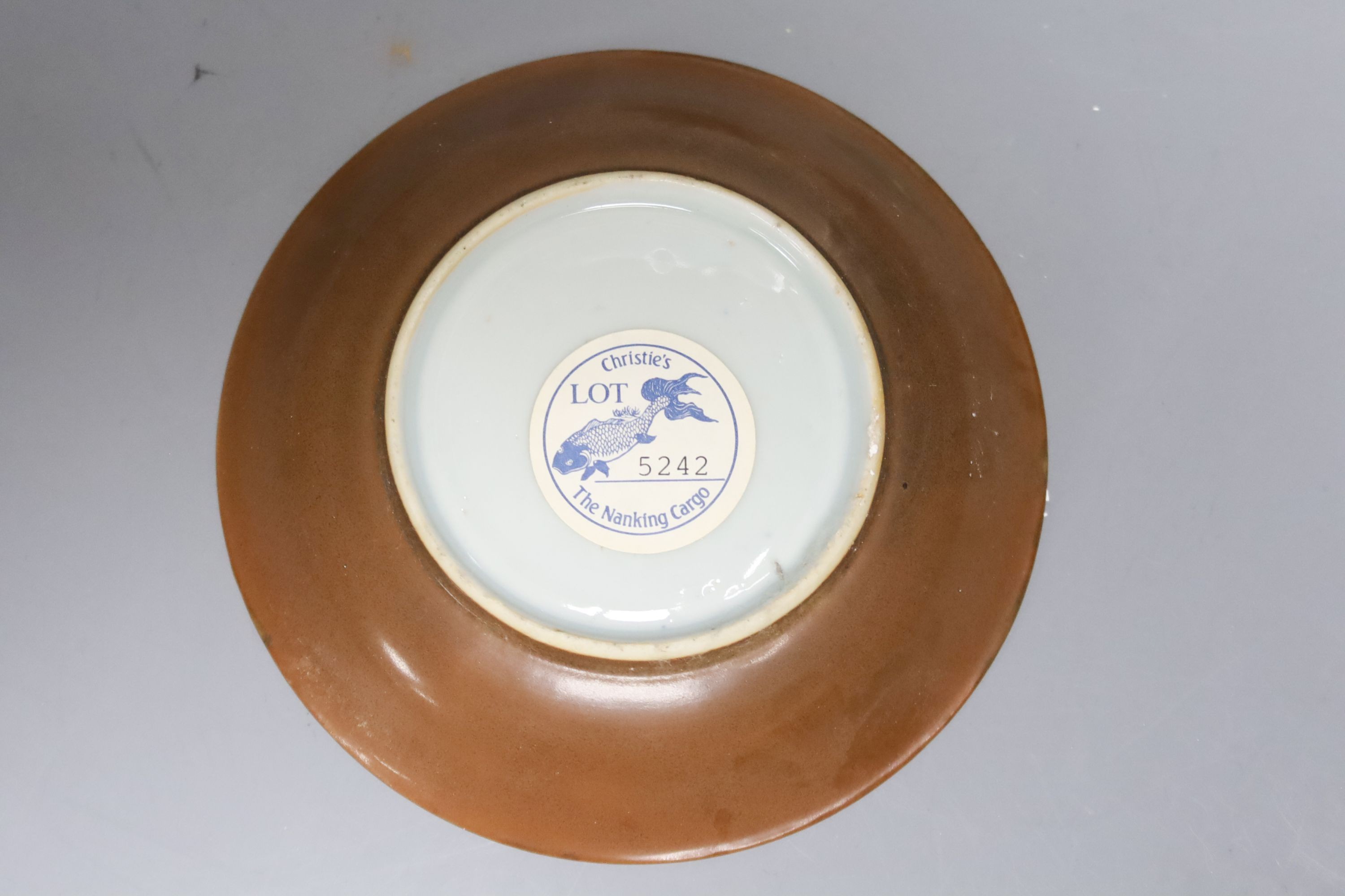 A set of four Chinese Nanking Cargo blue and white teabowls and saucers, with cafe au lait ground